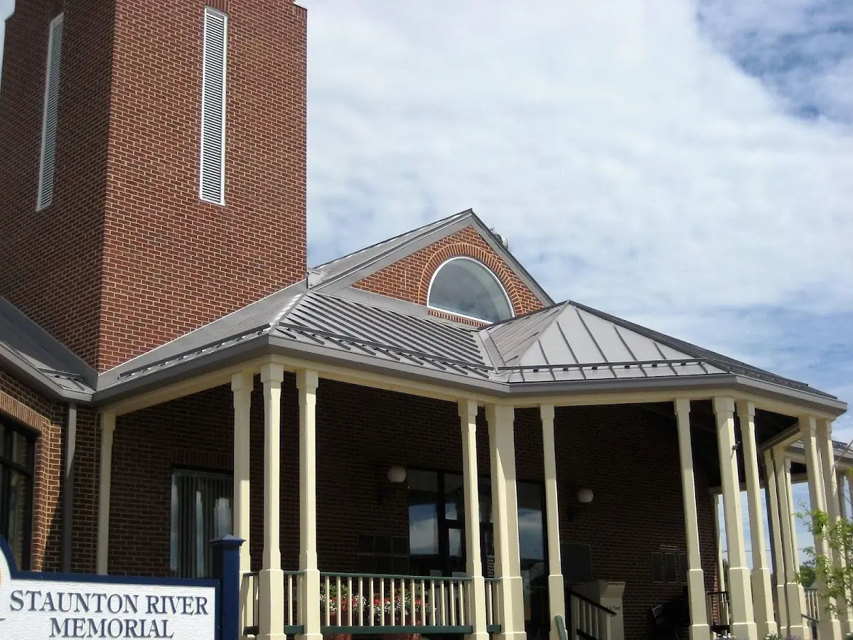 Skilled roofing craftsmen working on a residential roof in Willimantic